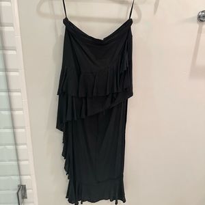 Three of Something Black skirt. Mini in front long in back. Size 4. Sexy